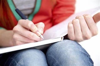 Girl Writing Essay writing coach